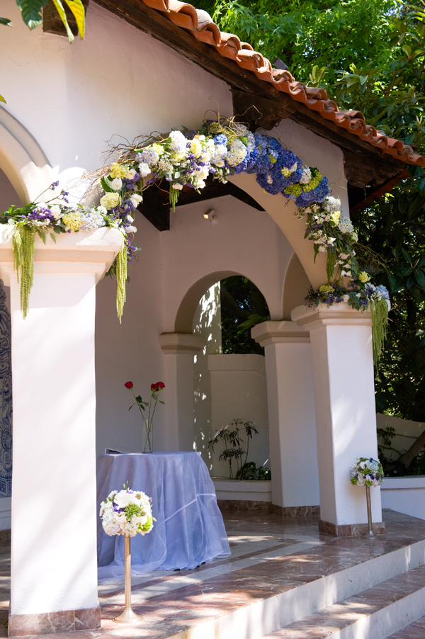 The wedding arch consisted of curly willow branches eucalyptus lisianthus